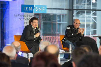 Andreas Dracopoulos, President of the Stavros Niarchos Foundation and Lina Mendoni, Minister of Culture, sit on stage and communicate with the audience watching them